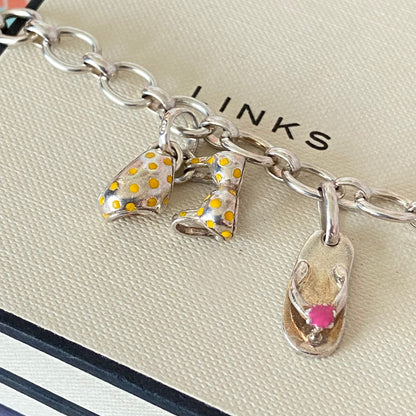 Links of London T-Bar Signature Bracelet with a Flip Flop and Yellow Polka Dot Bikini.