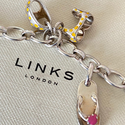 Links of London T-Bar Signature Bracelet with a Flip Flop and Yellow Polka Dot Bikini.