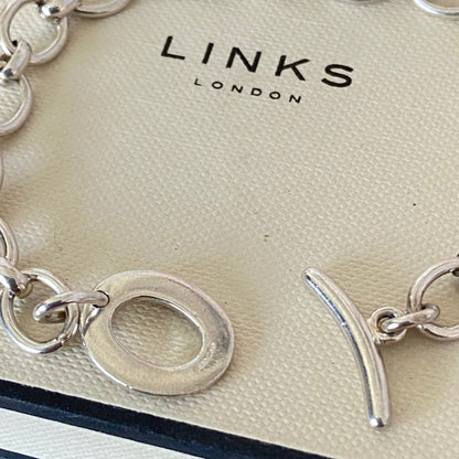 Links of London T-Bar Signature Bracelet with a Flip Flop and Yellow Polka Dot Bikini.