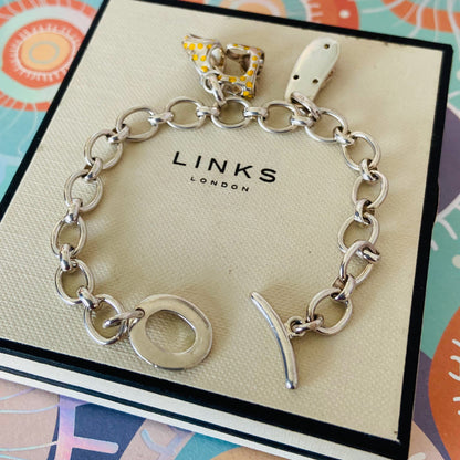 Links of London T-Bar Signature Bracelet with a Flip Flop and Yellow Polka Dot Bikini.
