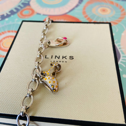 Links of London T-Bar Signature Bracelet with a Flip Flop and Yellow Polka Dot Bikini.