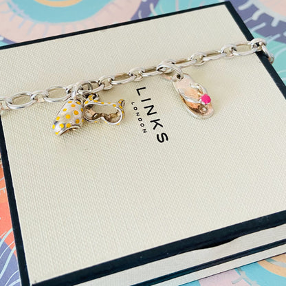 Links of London T-Bar Signature Bracelet with a Flip Flop and Yellow Polka Dot Bikini.