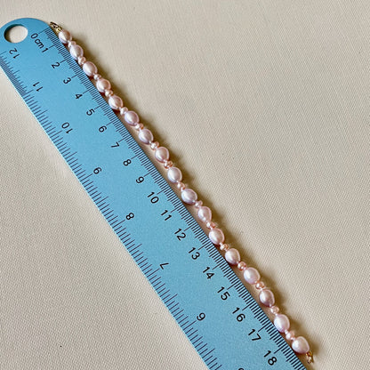 Stunning Pink Cultured Freshwater Pearl Bracelet with a delicate 9ct gold clasps securing it perfectly.  Hallmarked 375 on the clasp presented in a beautiful wooden box