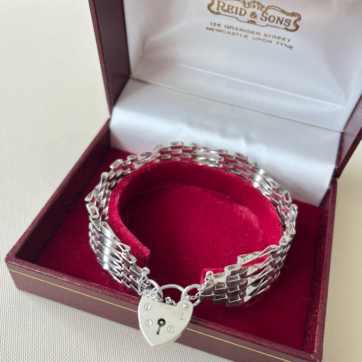 Sterling Silver 5 Gate Vintage Bracelet Stamped 925 with the Heart Lock Charm and safety chain.  22grams of Sterling Silver