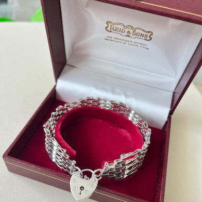 Sterling Silver 5 Gate Vintage Bracelet Stamped 925 with the Heart Lock Charm and safety chain.  22grams of Sterling Silver