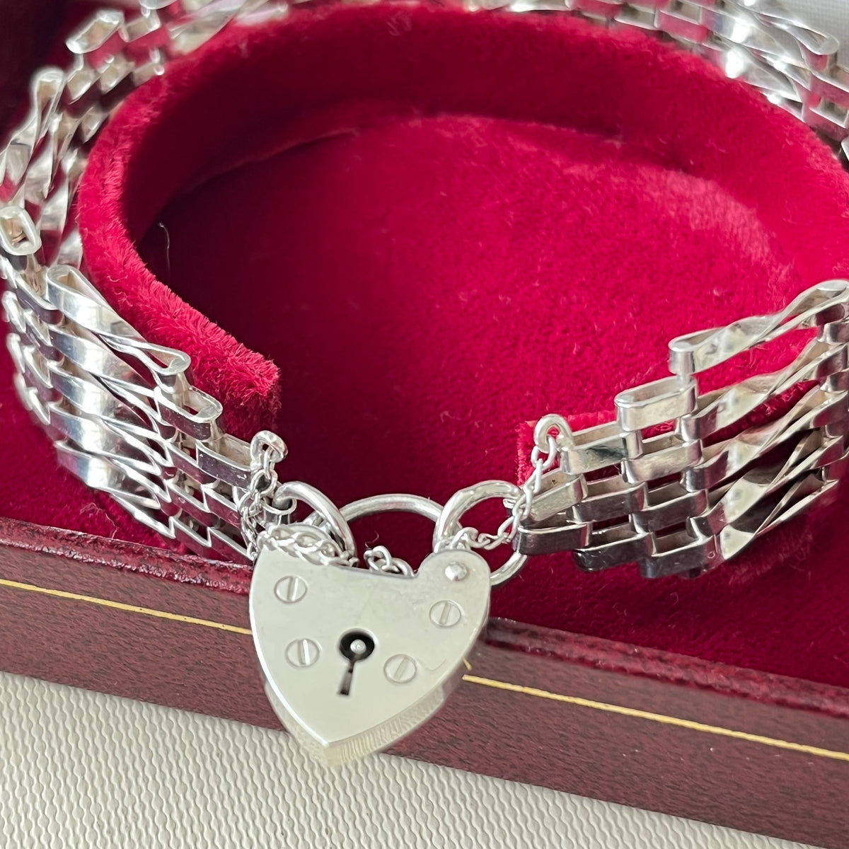 Sterling Silver 5 Gate Vintage Bracelet Stamped 925 with the Heart Lock Charm and safety chain.  22grams of Sterling Silver