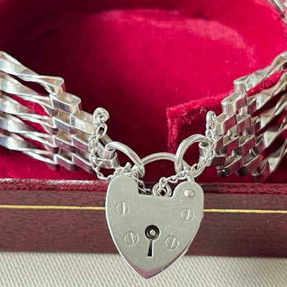 Sterling Silver 5 Gate Vintage Bracelet Stamped 925 with the Heart Lock Charm and safety chain.  22grams of Sterling Silver