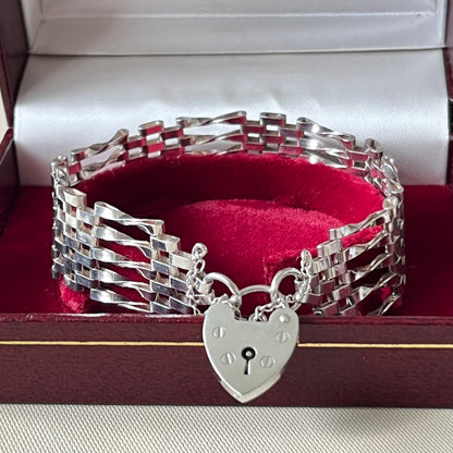 Sterling Silver 5 Gate Vintage Bracelet Stamped 925 with the Heart Lock Charm and safety chain.  22grams of Sterling Silver