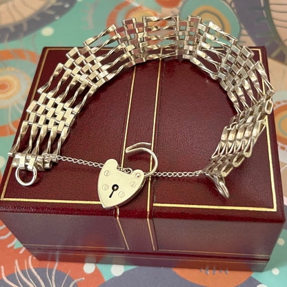 Sterling Silver 5 Gate Vintage Bracelet Stamped 925 with the Heart Lock Charm and safety chain.  22grams of Sterling Silver