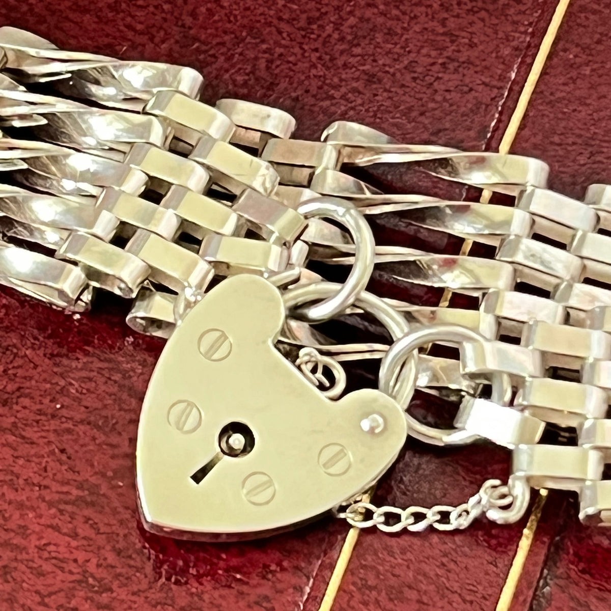 Sterling Silver 5 Gate Vintage Bracelet Stamped 925 with the Heart Lock Charm and safety chain.  22grams of Sterling Silver