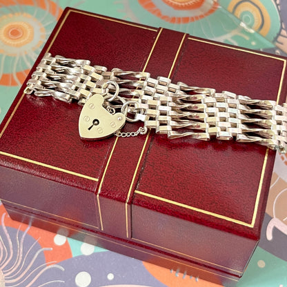 Sterling Silver 5 Gate Vintage Bracelet Stamped 925 with the Heart Lock Charm and safety chain.  22grams of Sterling Silver