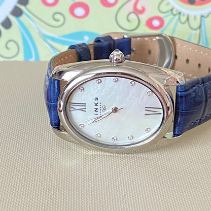 Rare Links of London Driver Ellipse Watch with Mother of pearl face, 10 Sapphire Crystals a Blue Real Leather Strap.
