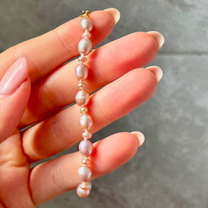 Stunning Pink Cultured Freshwater Pearl Bracelet with a delicate 9ct gold clasps securing it perfectly.  Hallmarked 375 on the clasp presented in a beautiful wooden box