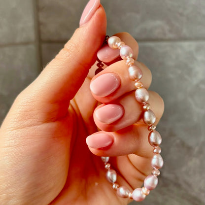 Stunning Pink Cultured Freshwater Pearl Bracelet with a delicate 9ct gold clasps securing it perfectly.  Hallmarked 375 on the clasp presented in a beautiful wooden box