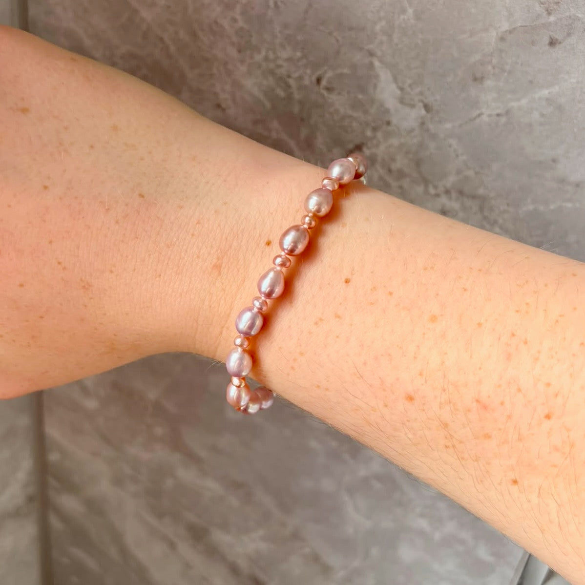 Stunning Pink Cultured Freshwater Pearl Bracelet with a delicate 9ct gold clasps securing it perfectly.  Hallmarked 375 on the clasp presented in a beautiful wooden box