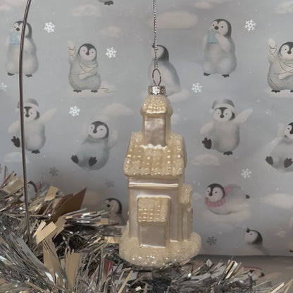shimmering  champagne glass church Christmas ornament accented with sparkling glitter snow details